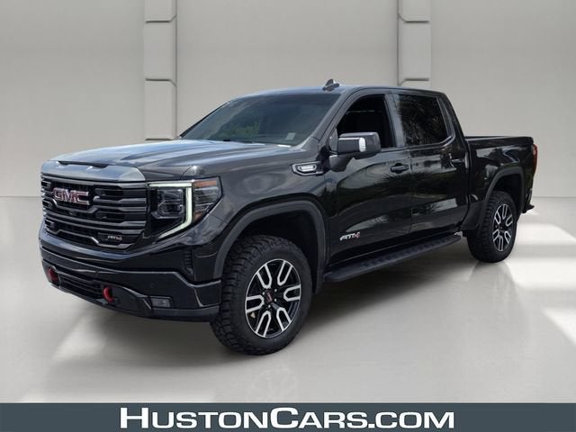 2024 GMC Sierra 1500 AT4 in Onyx Black — front three-quarter view