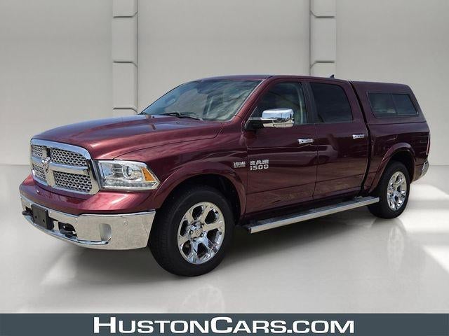 2017 RAM 1500 Laramie 4x4 Crew Cab 5'7" Box in Delmonico Red Pearlcoat — front three-quarter view
