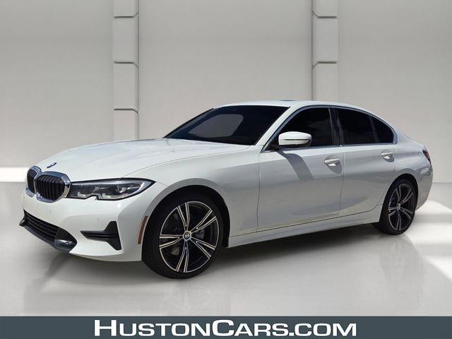 2022 BMW 330i Sedan North America in Alpine White — front three-quarter view